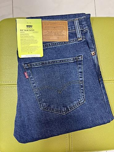 Джинсы: Levi’s 512 Slim Taper — мужские джинсы с заужением к низу. - Линия — 4
