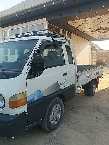 mersedes axor: Hyundai Porter (бортовой малотоннажный грузовик) - Кузов: бортовая — 4