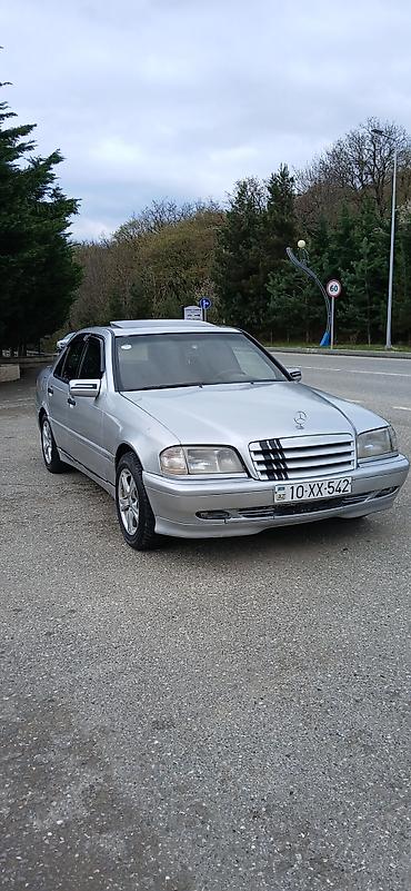 mersedes peci: Mercedes-Benz C‑Class W202 sedan – gümüş rəng. Masin yaxsi — 1