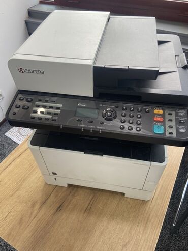 карманный компьютер: Многофункциональное устройство Kyocera с функцией лазерной печати