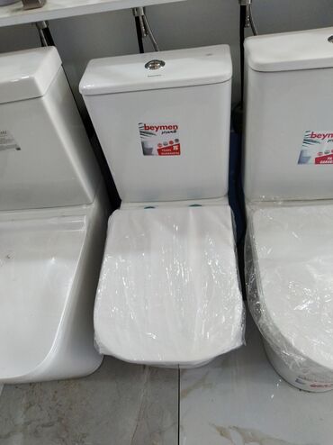 Unitazlar: Beymen firmasının istehsalı olan, ağ rəngdə unitaz. Yığcam forması