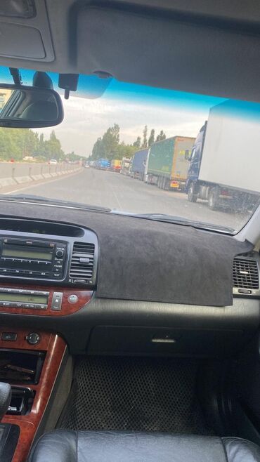 бмв м5 ф90 цена бишкек: Автомобиль Toyota Camry серебристого цвета, представленный в кузове