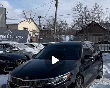 киа optima: Чёрный седан Kia Optima. Автомобиль имеет стильную решётку радиатора и