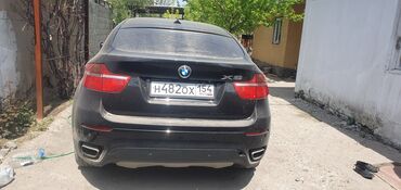 бмв самурай черный: Автомобиль BMW X6 представлен в черном цвете. Модель имеет характерные