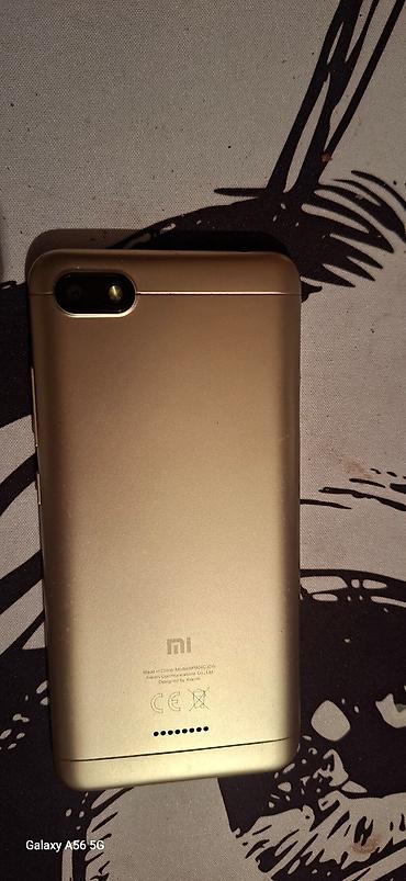 Смартфон Xiaomi (серия Redmi), золотистый корпус. Характеристики и
