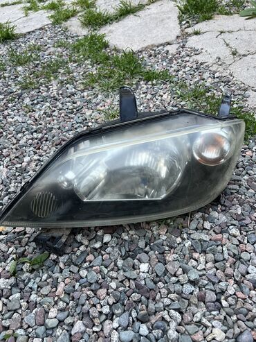 мерседес 210 2 2: Алдыңкы сол фара Mazda 2003 г., Оригинал, Жапония