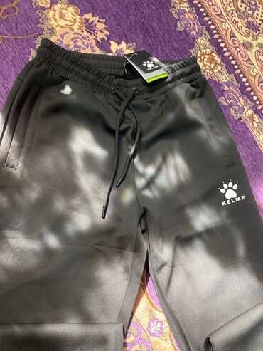 женские пиджаки для полных: Спортивные брюки KELME - Цвет: черный - Материал: плотный мягкий