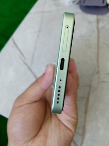 Другие мобильные телефоны: Redmi Note 13 Смартфон в мятно‑зеленом цвете с плоскими гранями и — 4