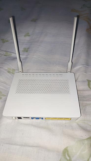 Modemlər və şəbəkə avadanlıqları: Huawei EchoLife HG6548M GPON ONU router - İki güclü Wi‑Fi anteni ilə — 1