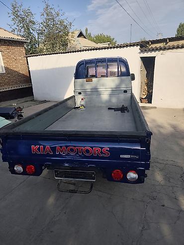 борта: KIA Bongo (K2500/K2700) бортовой малотоннажный грузовик, синий цвет — 3