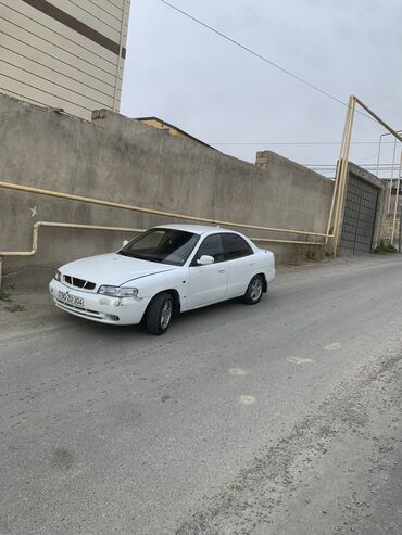 06 mawinlar: Daewoo Nubira: 1.6 l | 1998 il Sedan