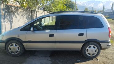 жук ташуучу унаа: Opel Zafira (A) — серебристый 7‑местный компактвэн. Основные