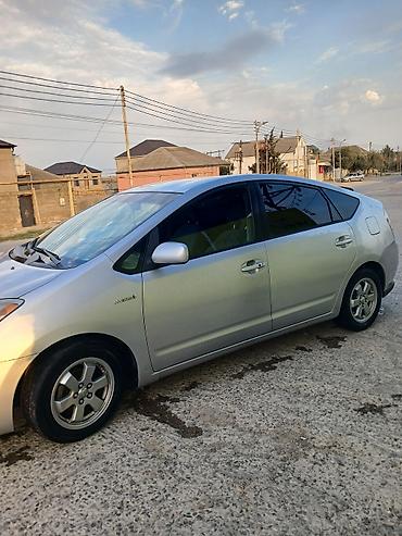 prius sveca: Toyota Prius (2-ci nəsil) – gümüşü rəng, hibrid hetçbek. Texniki — 5