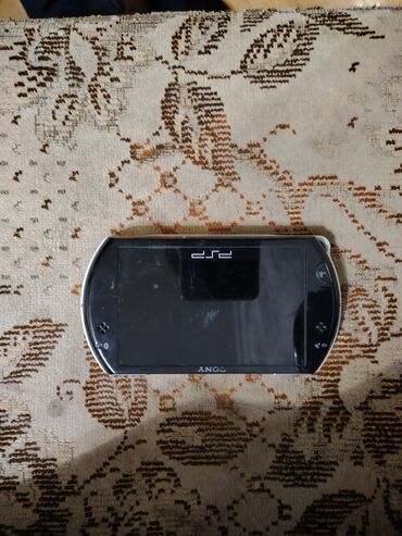 PSP (Sony PlayStation Portable): Psp go satılır tam işlək vəziyyətdədir. İçinde gta vice city stories