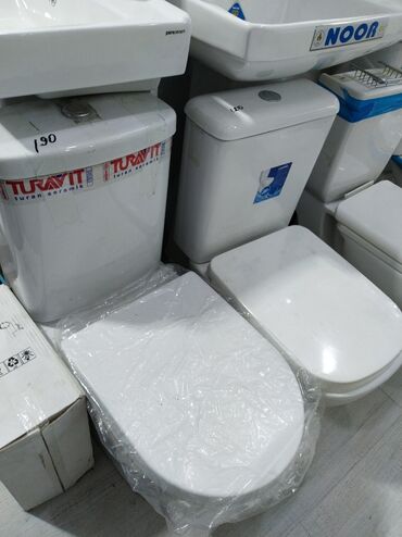 unutazlar: Ağ rəngli unitaz dəsti, hamam otaqları üçün nəzərdə tutulub. Dəst
