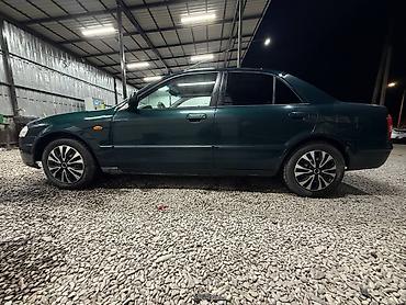 мини электро: Mazda 323: 2000 г., 1.3 л, Механика, Бензин, Седан — 2