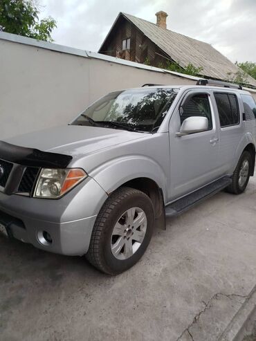 опель фронтера а: Автомобиль Nissan Pathfinder серебристого цвета с рейлингами на крыше