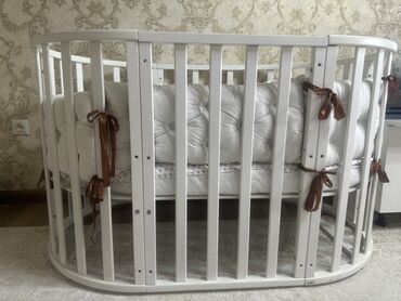 овальная кровать: Манеж керебет, Колдонулган, Бүктөө, Жыгач