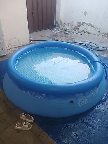 islenmis hovuzlar: Şişmə hovuz – dairəvi, mavi rəng, “Easy Set” tipli. - Ölçü: təxminən — 1