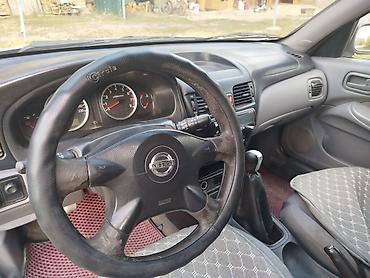 сапат бетон: Nissan Almera: 2003 г., 1.5 л, Кол менен иштөөчү, Бензин, Хетчбек — 6