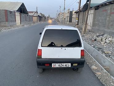 митсубиси спейк стар: Компактный городской хэтчбек 5‑дверный, белый цвет. Особенности: - — 6