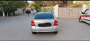 4 bolt 16: Opel Astra G (sedan/həb) – gümüşü rəng SALAM MAŞIN EVELDEN GELENDEN — 4