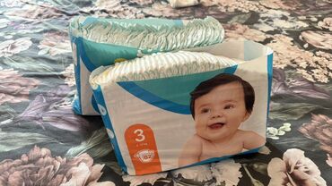 Oyuncaqlar: Pampers 3, 6-10 kg. использовали 2-3 штуки, подгузник, потом малыш