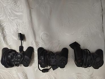 PS2 & PS1 (Sony PlayStation 2 & 1): PlayStation 2 Slim (SCPH seriyası) komplekti Paketdə: - PlayStation 2 — 9
