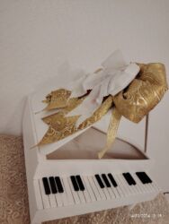 Xonça: Xonca piano satilir icine sokolad ve cicek qoyub hediyye etmek olar — 7