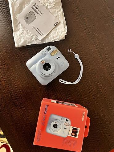 мереке видео: Fujifilm Instax mini 12 — мгновенная камера в цвете Pastel Blue — 1
