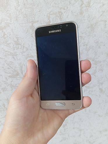 Mobil telefonlar: Samsung Galaxy J1, 4 GB, rəng - Qızılı, Düyməli, Sensor, İki sim kartlı — 2