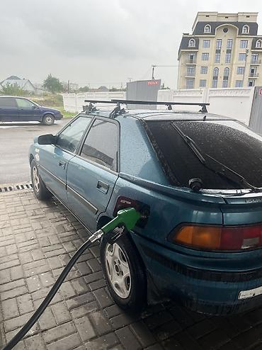 крыло на фит: Mazda 323: 1994 г., 1.3 л, Механика, Бензин, Хэтчбэк — 1