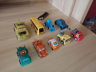 Игрушки: Набор игрушечных транспортных средств Состав: - Большой автовоз с — 10