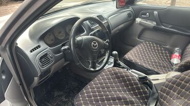 Mazda: Mazda 323: 2003 г., 2 л, Механика, Бензин, Хэтчбэк