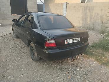 Унаа сатуу: Mazda 323: 1996 г., 1.8 л, Кол менен иштөөчү, Бензин, Седан — 3
