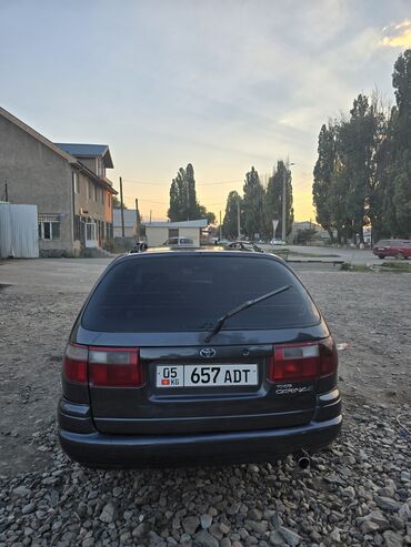 киридит машина: Универсал Toyota Carina E, представленный в темно-сером цвете