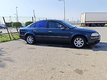 changan disk: Volkswagen Passat sedan. Avtomobil tünd göy rəngdədir və klassik — 3