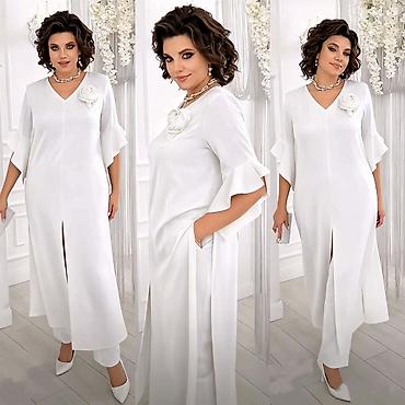 Kompleti: Komplet, haljina+pantalone
Cena 2900
Uni vel.
V23 — 8
