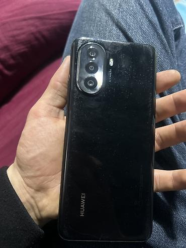 Мобильные телефоны и аксессуары: Huawei Nova Y70, 128 ГБ, цвет - Черный — 1