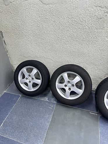 r15 100 4: Комплект из 4 колес в сборе: литые диски + шины. - Диски — 1