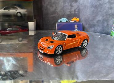 Avtomobil modelləri: Коллекционная модель Opel Speedster orange 2000 DeAgostini Art  — 2