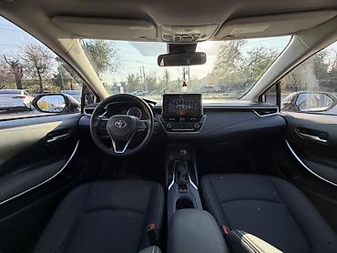 2023 kia ev5: Toyota Corolla: 2020 г., 1.8 л, Вариатор, Гибрид, Седан — 7
