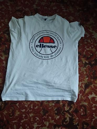 Футболки: Футболка Ellesse, белая, с крупным фирменным логотипом на груди — 1