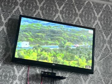 телефонные аппараты с беспроводной трубкой беспроводной проводной: Телевизор LG с плоским экраном, диагональ примерно 42". Корпус черный