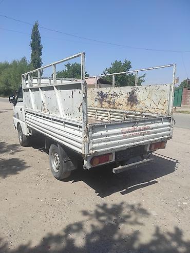 каракол мото: Грузовой малотоннажный бортовой автомобиль (кабина над мотором), белый — 3