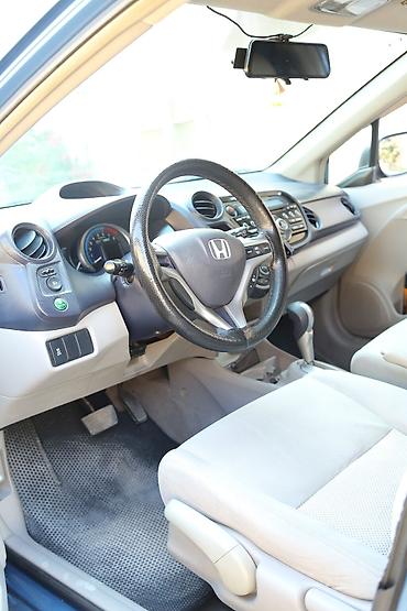 Honda: Honda Insight Hybrid, mavi rəng, 5 qapılı liftbek gövdə. Əsas — 7