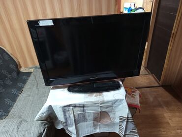 режим 7 а: Телевизор Hisense модели LE32K09 в черном корпусе. Оснащен различными