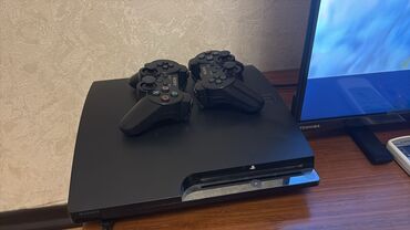 irsad electronics playstation 3: Sony PlayStation 3 Slim oyun konsolu. Bu model iki ədəd simsiz oyun