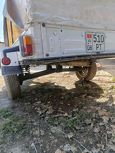 Одноосный прицеп к легковому автомобилю с тентом. - Металлический
