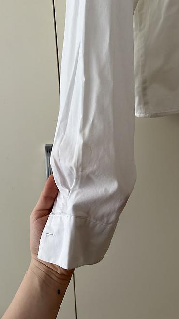 Ziyafət donları: - Məhsul: Oversize T‑shirt - Brend/Qrafika: “NEW ERA” mövzulu çap; ön — 9